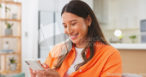 Image of Phone, online and woman relax texting in a home, house or apartment and laughing at funny internet meme on social media. Smile, happy and chatting on mobile communication app using smartphone