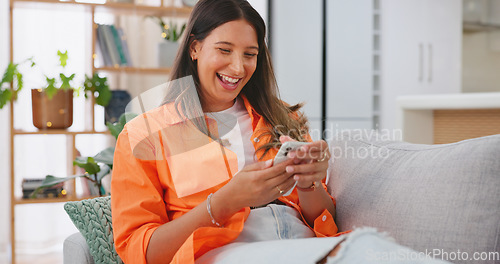 Image of Woman, phone and laughing for funny joke, meme or social media post relaxing on living room sofa at home. Happy female chatting, texting and laugh on smartphone for fun online communication on couch