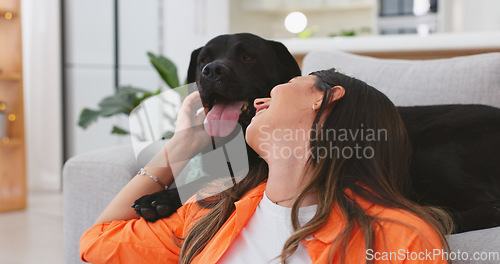 Image of Happy woman relax with her dog at home for mental health, wellness or emotional support, love and care. Young person sitting on living room floor and pet, animal or Labrador retriever kiss and stroke