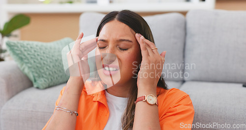 Image of Headache, sick woman and pain in home of stress, dizzy brain or mental health crisis in house. Sad female with migraine, tension and anxiety of burnout, medical problems and frustrated face in lounge