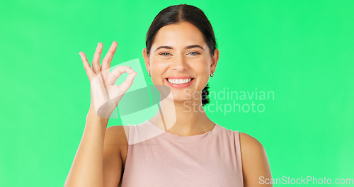 Image of Face, green screen and woman with ok sign, perfect and happiness against a studio background. Portrait, female and happy person with hand gesture for approval, symbol for agreement and satisfaction