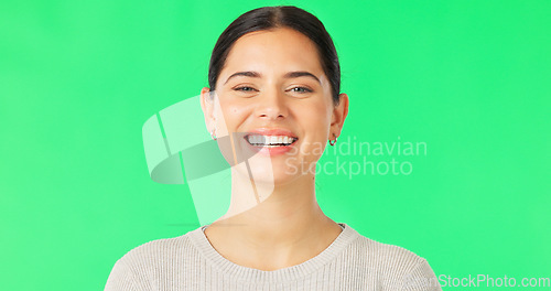 Image of Green screen, face and woman with smile, happiness and confidence on color background, backdrop and chroma key. Portrait of happy female model with pride, good mood and carefree personality in studio