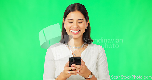 Image of Happy woman, smartphone and typing on green screen, studio and social media post of funny meme online. Female model, laughing and texting on cellphone, download mobile games or search digital contact