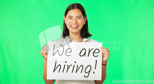 Image of Woman with hiring sign, job advertising on green screen and smile, mockup with portrait. Billboard, poster and happy female with board with text, work opportunity and recruitment on studio background