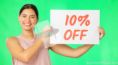 Image of Portrait, woman and sale sign on green screen advertising percentage or discount rate on paper or banner. Smile of a happy female on a studio background for promotion deal, savings or deal and offer