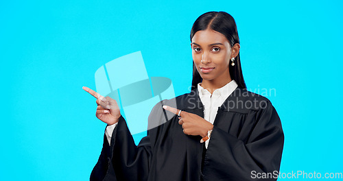 Image of Portrait mockup or woman lawyer pointing in studio for product placement, advertising or marketing. Mockup space, legal job or Indian girl attorney showing promotion offer or deal on blue background