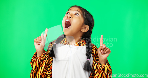 Image of Shock, green screen and face of a child pointing isolated on a studio background. Wow, looking and portrait of a girl gesturing with hands on a mockup space backdrop for announcement or presentation