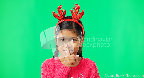 Image of Shush, Christmas and secret with girl in green screen studio for holiday, gossip and gift. Surprise, festive and announcement with child isolated in background for celebration, privacy and present