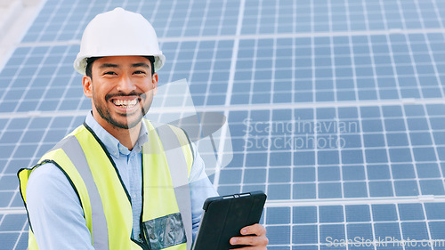 Image of Solar, electricity and construction being done by an engineer while using a tablet for research or planning. Portrait of one young and cheerful architect smiling while browsing on technology