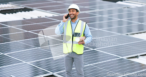 Image of Ambitious, happy and confident solar power installer, engineer and electrician talking on a phone while discussing blueprint plans for construction, building and maintenance of renewable energy