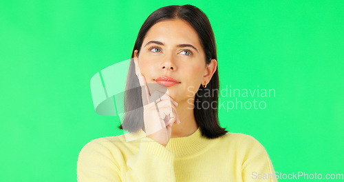 Image of Face, thinking and consider with a woman on a green screen background in studio to decide her options. Idea, mind and contemplating with an attractive young female looking thoughtful on chromakey