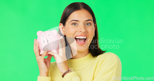 Image of Happy woman, face and money savings on green screen for investment, budget or finance against studio background. Portrait of excited female holding piggybank for coin, profit or investing on mockup