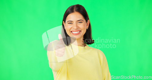 Image of Happy woman, thumbs up and green screen for winning, success or agreement against a studio background. Portrait of female face with smile showing thumb emoji, yes sign or like on chromakey mockup