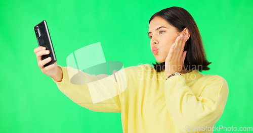 Image of Happy woman, face and selfie on green screen with peace sign and facial expressions against studio background. Silly or goofy female model smiling for photo, emoji or memory with smartphone on mockup