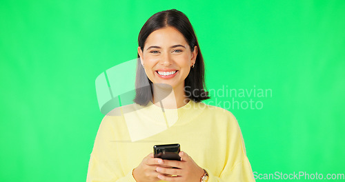 Image of Smile, woman and smartphone on green screen, face and studio for social media, online contact and meme. Portrait of happy female model typing on cellphone, download mobile games or scroll for texting