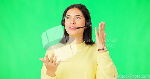 Image of Woman, call center and consulting with headphones on green screen in customer service against a studio background. Happy female consultant or agent talking with headset for telemarketing on mockup