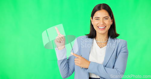 Image of Business, happy woman and face on green screen pointing to mockup background, studio and smile. Portrait of female worker advertising promotion, product placement and announcement of deal coming soon