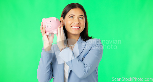 Image of Business woman, money and savings on green screen for investment, budget or finance against studio background. Portrait of happy female smile holding piggybank for coin, profit or investing on mockup
