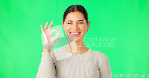 Image of Okay hands, face and woman smile on green screen, background and studio in agreement of support. Portrait of female model, happy and ok for success, yes and winner of perfect emoji, thank you or hope