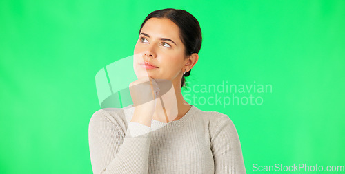 Image of Face, thinking and option with a woman on a green screen background in studio to consider a decision. Idea, mind and contemplating with an attractive young female looking thoughtful on chromakey