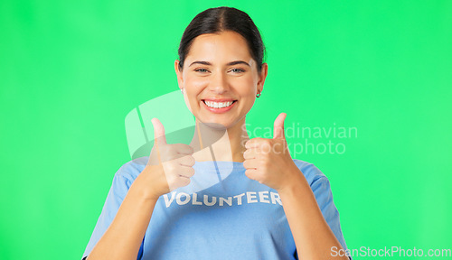 Image of Happy woman, volunteer and hands in thumbs up on green screen for agreement or success against a studio background. Portrait of female showing thumb emoji, yes sign or like for good job on mockup