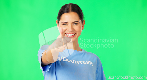 Image of Happy woman, volunteer and hand in thumbs up on green screen for agreement or success against a studio background. Portrait of female showing thumb emoji, yes sign or like for good job on mockup