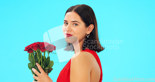 Image of Face, woman and rose bouquet in studio on blue background with fresh, floral or romantic gesture on mockup. Portrait, flower and girl with gift, present and romance, valentines or offering isolated