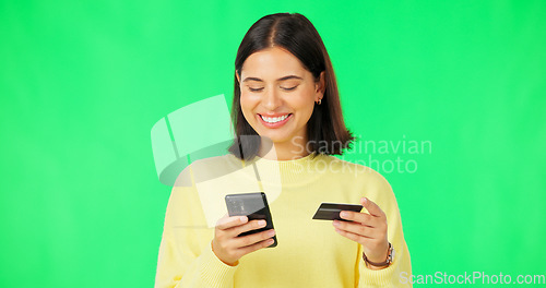 Image of Happy woman, phone and credit card on green screen for online shopping, ecommerce or purchase against studio background. Female shopper smile for smartphone transaction or internet banking on mockup