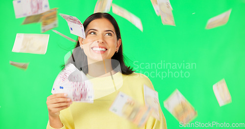 Image of Happy woman, cash and money rain on green screen for winning, prize or lottery against a studio background. Portrait of female winner with smile for financial freedom, wealth or investment on mockup