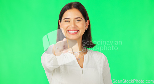 Image of Face, pointing to you and woman with green screen, smile and success on studio background. Portrait, female or person with gesture for space, show with finger or inspire with happiness or motivation