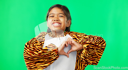 Image of Heart, green screen and love hand sign by kid excited, smile and excited isolated in studio background. Young, care and support gesture by girl or kid in tiger costume showing symbol or shape