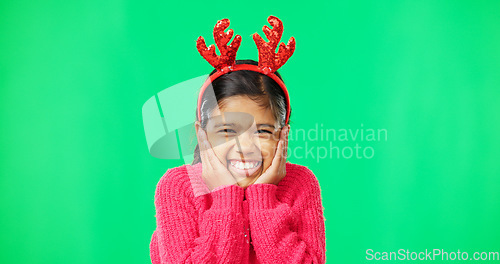 Image of Face, Christmas horns and girl excited, green screen and happiness against a studio background. Portrait, young person and female child with smile, Xmas and surprise with excitement, joy and cheerful