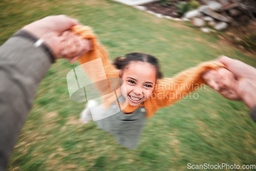 Image of Blur, happy and a child and father swinging, playing and bonding in the garden. Smile, playful and a little girl moving with energy during playtime with dad holding hands to swing in the backyard