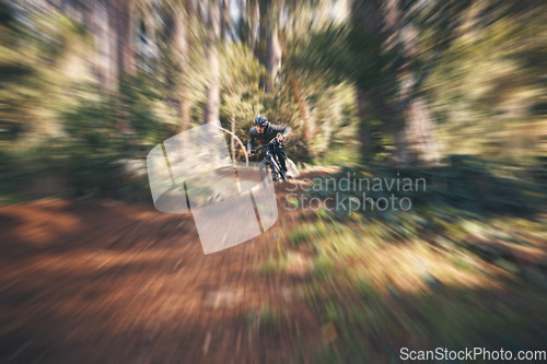 Image of Bike, cycling and motion blur with a man in nature for fitness, adventure or freedom in the forest. Bicycle, exercise and a male athlete cyclist outdoor in the woods for cardio or endurance training