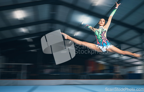 Image of Fitness, gymnastics and girl in arena jumping for competition sport, exercise and training with mockup space. Sports, movement and jump, professional woman gymnast in form and balance in performance.