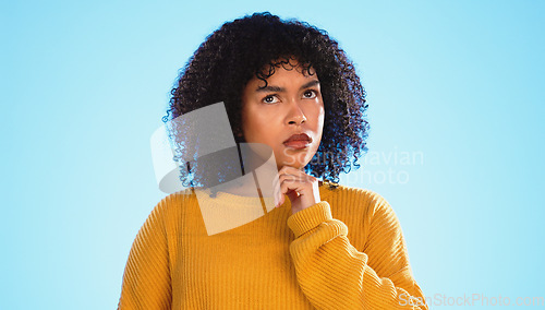 Image of Confused, face and thinking by black woman in studio, pensive and wondering on blue background. Doubt, portrait and unsure girl with decision, choice or emoji on mockup, product placement or isolated