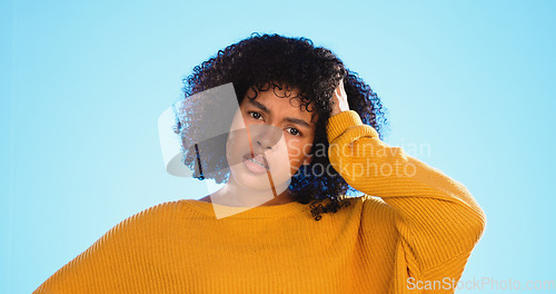Image of Face, confused and thinking by black woman in studio, pensive and wondering on blue background. Doubt, portrait and unsure girl with decision, choice or emoji on mockup, product placement or isolated