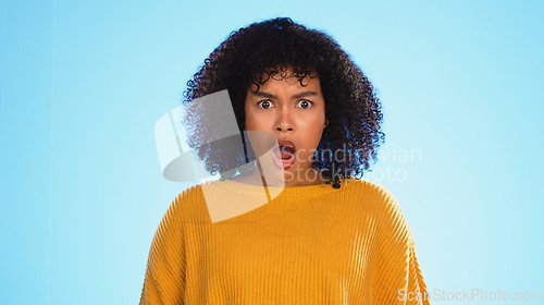 Image of Surprised, face of black woman in studio, Shocked and wondering on blue background. Doubt, portrait and unsure girl with decision, choice or emoji on mockup, product placement or isolated