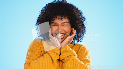 Image of Face, celebration and black woman excited, smile and success with girl on a blue studio background. Portrait, African American female and lady with happiness, winning and victory with joy or cheerful