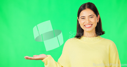 Image of Happy woman, hand and green screen for product placement, advertising or marketing against studio background. Portrait of female face with smile showing advertisement or sale on copy space mockup