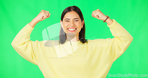 Image of Strong, happy face and woman muscle flex with green screen and smile from wellness. Gender equality, isolated and studio background with a young female feeling proud and confident from win and youth