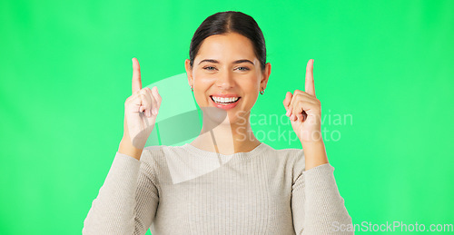 Image of Smile, face and woman on green screen pointing up to news on mockup color background. Portrait of female model advertising promotion, product placement or presentation of commercial offer coming soon