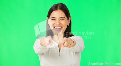 Image of Face, pointing to you and woman with green screen, motivation and happiness on studio background. Portrait, female and person with smile, show with finger and opportunity with cheerful and joyful