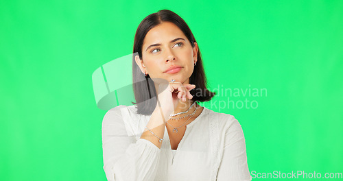 Image of Face, idea and decision with a woman on a green screen background in studio to consider an option. Thinking, mind and contemplating with an attractive young female looking thoughtful on chromakey