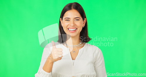 Image of Happy woman, hand and thumbs up on green screen for agreement, winning or success against a studio background. Portrait of female with smile showing thumb emoji, yes sign or like on chromakey mockup