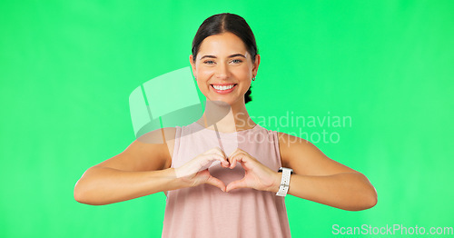 Image of Heart, hands and face of happy woman on green screen for fitness, wellness or healthy life. Female portrait, sports model and finger shape of love, support and motivation for care, emoji sign or icon