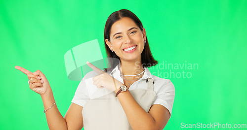 Image of Woman is pointing, marketing and face on green screen, mockup space with product placement and smile. Advertising, branding and logo promo with happy female, show or display on studio background