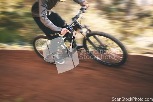 Image of Bike, cycling, and fast with man in nature for training, extreme sports and motion blur. Workout, race and speed with cyclist in forest park for performance, fitness challenge and adventure