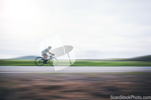 Image of Person cycling fast with motion blur, sky mockup and bike in countryside, triathlon and cardio training. Athlete, bicycle and marathon race with speed, energy and sports for exercise, power or action