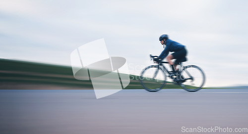 Image of Motion blur, race and cycling with woman on road for training, competition and championship. Workout, sports and triathlon with female cyclist riding on bike for freedom, exercise and fast with speed